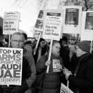 Protestors in the UK holding signs on stopping arms sales to Saudia Arabia